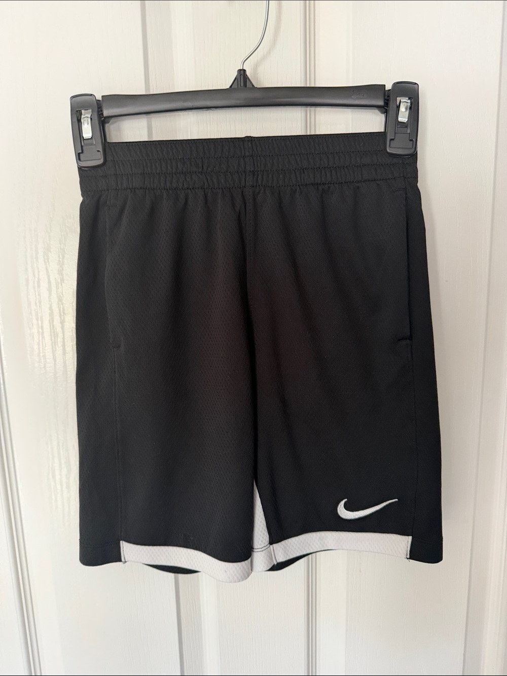 Nike Black Athletic Shorts with White Hem and Swoosh